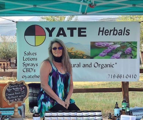 Tammie Lowell poses with her Oyate Herbals products.