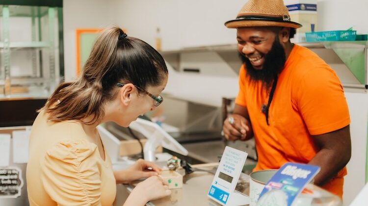 man and women t counter smiling. cannabis terms