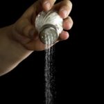 salt pours out of a shaker